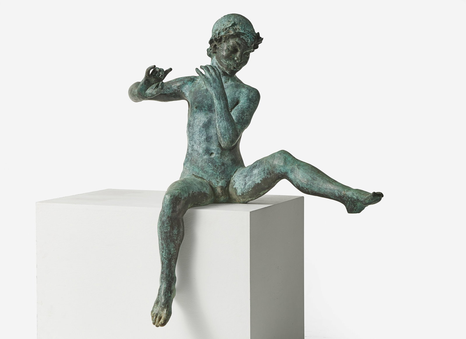 A bronze garden statue of Pan   With verdigris patina.  H: 46 in. W: 36 ½ in. D: 31 in. (1 of 2)