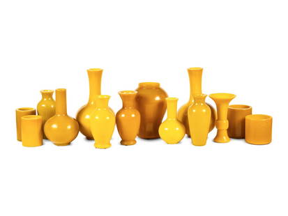 A Collection of Fourteen Chinese Yellow Peking Glass Vases: A Collection of Fourteen Chinese Yellow Peking Glass Vases comprising ten vases and four brush pots, the gu-form vase bearing a four-character mark at bottom, Qianlong nian zhi. Height of tallest 16