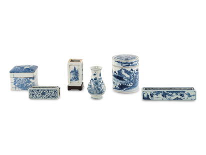 Six Chinese Blue and White Porcelain Wares: Six Chinese Blue and White Porcelain Wares comprising two reticulated scroll weights, the smaller one bearing a with Qianlong nian zhi mark, a square brush pot, a Japanese covered box with ink well an