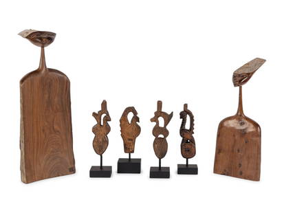 A Group of Six African Carved Wood Articles: A Group of Six African Carved Wood Articles comprising four pulleys and two carved busts. Height of taller bust 17 3/4 inches.