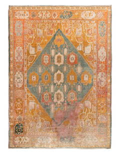 An Oushak Wool Rug: An Oushak Wool Rug West Anatolia, Late 19th Century 11 feet 5 inches x 8 feet 4 inches.