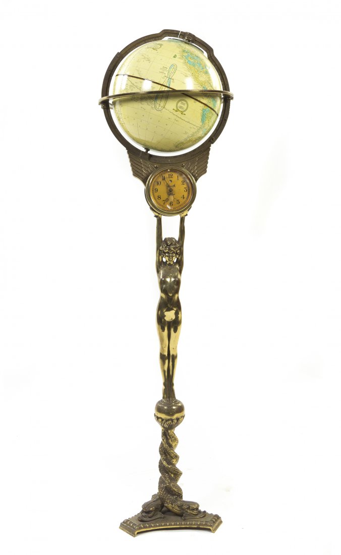 A Crams Library Globe on a Figural Stand, Height: A Crams Library Globe on a Figural Stand, 20th century, the globe set on a unilock figural stand, raised on a tripartite dolphin form base, electrified as a lamp. Height 55 1/4 inches.