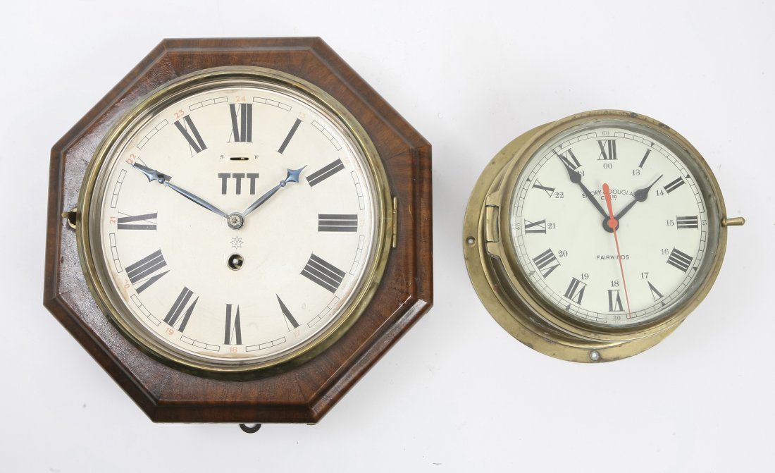 Two Wall Clocks, Junghans and Emory & Douglas, Wi: Two Wall Clocks, Junghans and Emory & Douglas, one having an octagonal mahogany case and the other a brass ship's clock, each having a circular dial with Roman numeral hours. Width of widest 11 inches