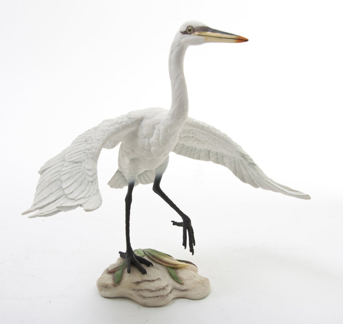 A Boehm Porcelain Model of a White Egret, Height : A Boehm Porcelain Model of a White Egret, depicted with wings spread and one leg raised. Height 8 1/2 inches.