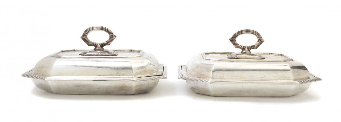 Two Sheffield Plate Covered Entrees, Asprey & Co.: Two Sheffield Plate Covered Entrees, Asprey & Co., each of rectangular form with canted corners and reeded borders. Width 11 1/8 inches. Property from the Estate of Helen and C. Nicholas Johnson, Jr.,