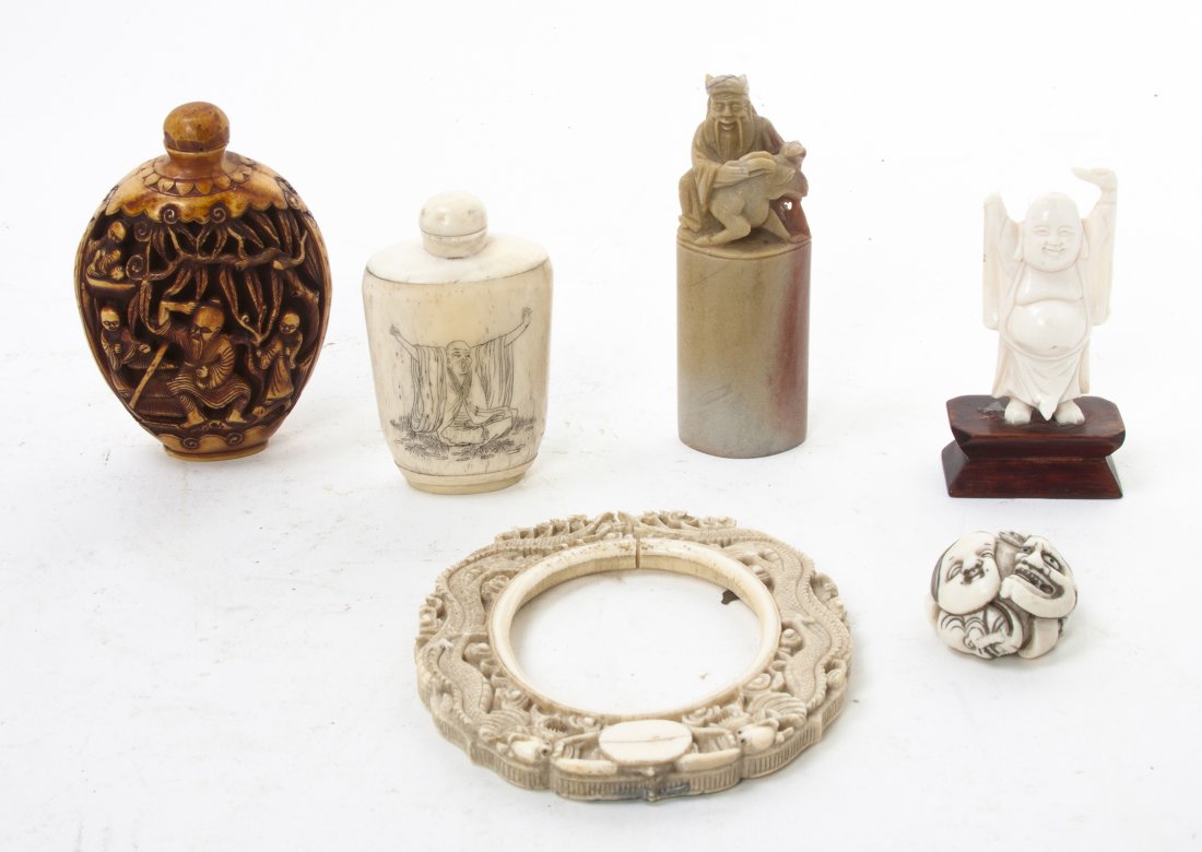 A Collection of Chinese Carved Ivory Articles, He: A Collection of Chinese Carved Ivory Articles, including a happy standing Buddha, a picture frame relief carved with two dragons, together with a bone snuff bottle, a Japanese ivory netsuke, a stained