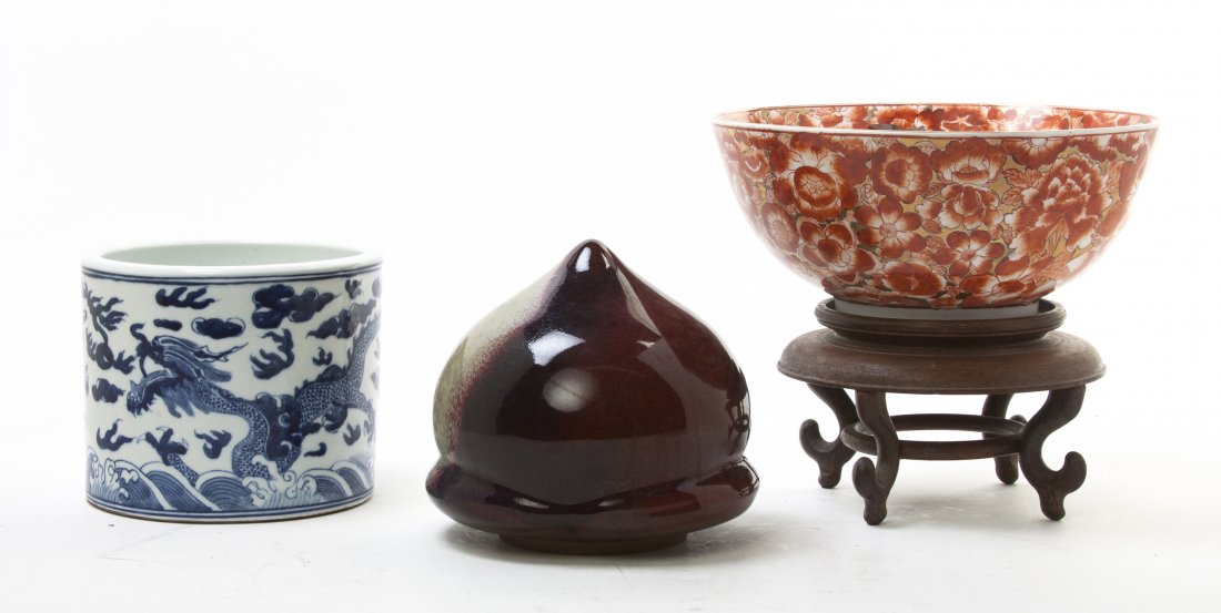Two Chinese Porcelain Articles, Diameter of first: Two Chinese Porcelain Articles, including a blue and white decorated brush pot depicting two opposing dragons chasing a flaming pearl, a footed center bowl decorated with various flowers and having gi