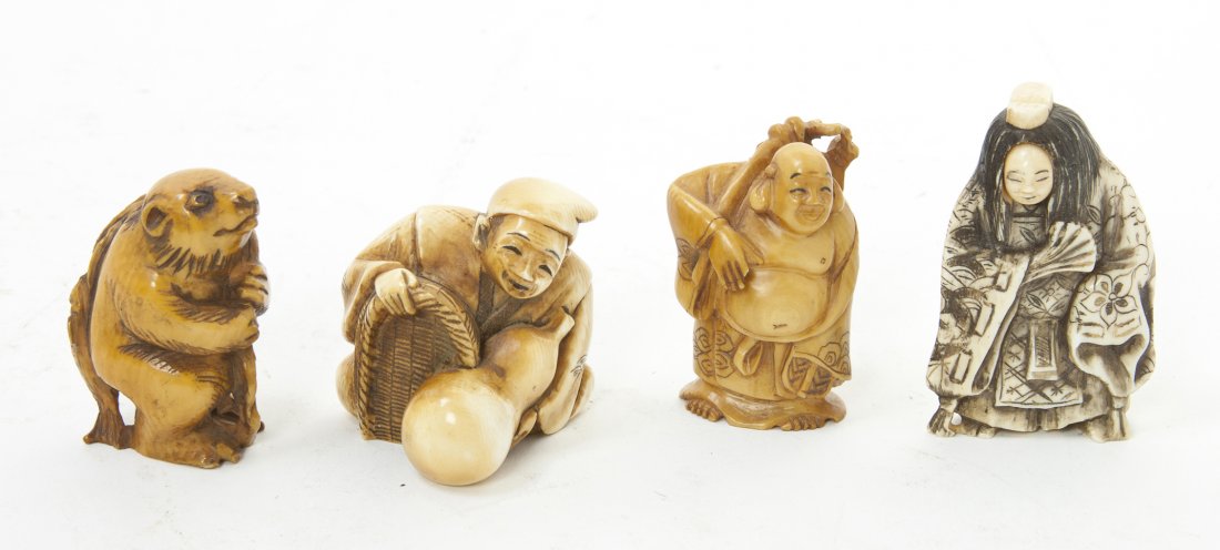 A Collection of Four Ivory Netsuke, Height of tal: A Collection of Four Ivory Netsuke, one depicting an immortal, one a kabuki actor, one a man with a double gourd and one modeled after an otter with a fish. Height of tallest 2 1/8 inches. Property fr