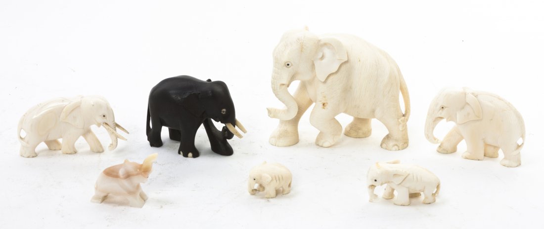 Five Carved Ivory Elephants, Width of widest 4 in: Five Carved Ivory Elephants, of varying sizes and poses, together with an ebonized wood example and an agate example. Width of widest 4 inches.