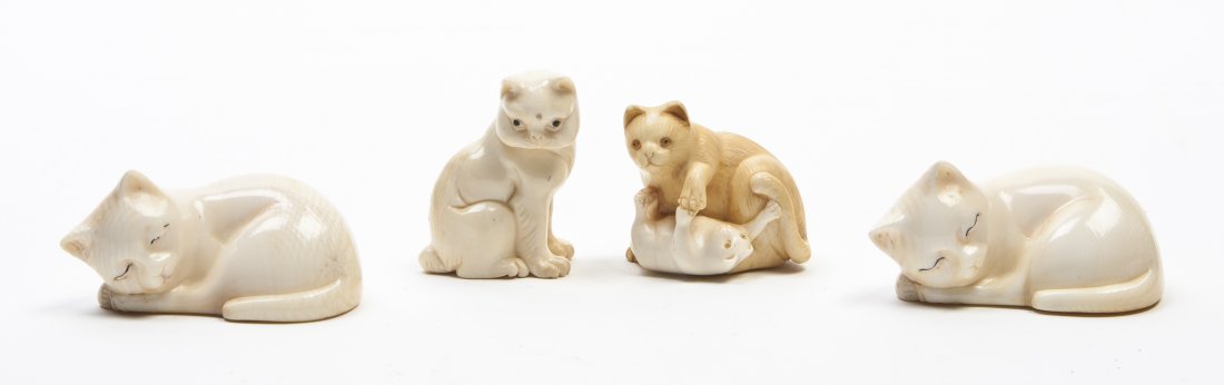 Four Japanese Carved Ivory Netsuke, Width of wide: Four Japanese Carved Ivory Netsuke, one depicting a seated cat, one depicting a mother cat with a kitten, the others depicting sleeping cats. Width of widest 2 1/2 inches.