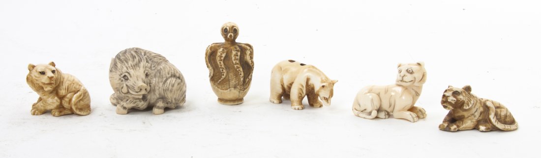 Six Japanese Carved Ivory Netsuke, Height of tall: Six Japanese Carved Ivory Netsuke, three in the form of tigers and large cats, the others depicting a wild boar, a bear and an octopus. Height of tallest 1 1/4 inches.