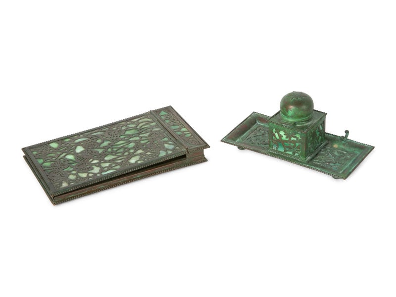 A Group of Arts and Crafts Style Bronze and Glass Desk Articles: A Group of Arts and Crafts Style Bronze and Glass Desk Articles Early 20th Century comprising a standish and a writing slope; the standish stamped Apollo Studios/ New York to the underside.
