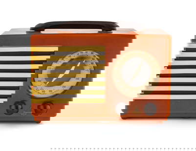 An Emerson Patriot Aristocrat 400 Radio: An Emerson Patriot Aristocrat 400 Radio Designed by Norman Bel Geddes, 1940 having a burnt orange case with brown handle, knobs and brown and white grille.Height 7 1/4 x length 10 7/8 x depth 5 3/8 in