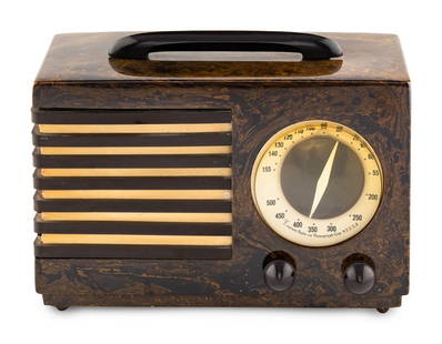 An Emerson Patriot Aristocrat 400 Radio: An Emerson Patriot Aristocrat 400 RadioDesigned by Norman Bel Geddes, 1940having a marbleized brown case with brown knobs and brown and white grille. Height 7 1/4 x length 10 7/8 x depth 5 3/8