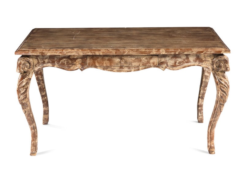 An Italian Carved and Painted Desk: An Italian Carved and Painted Desk 20th Century Height 30 x width 54 x depth 29 7/8 inches. This lot is located in Chicago.