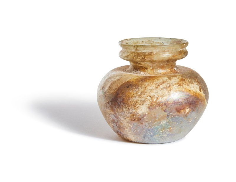 A Roman Glass Jar: A Roman Glass Jar Circa 1st-4th Century A.D. Height 3 inches (7.6 cm). This lot is located in Chicago. Property from Mr. John Hushon, Naples, Florida, sold to benefit the Panther Def