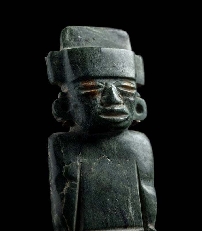 A Teotihuacan Greenstone Standing Figure: A Teotihuacan Greenstone Standing Figure Circa 3rd-7th Century A.D. Height 6 1/2 inches (16.51 cm). This lot is located in Chicago. Property from the Estate of Charles S. Hopper, Ch