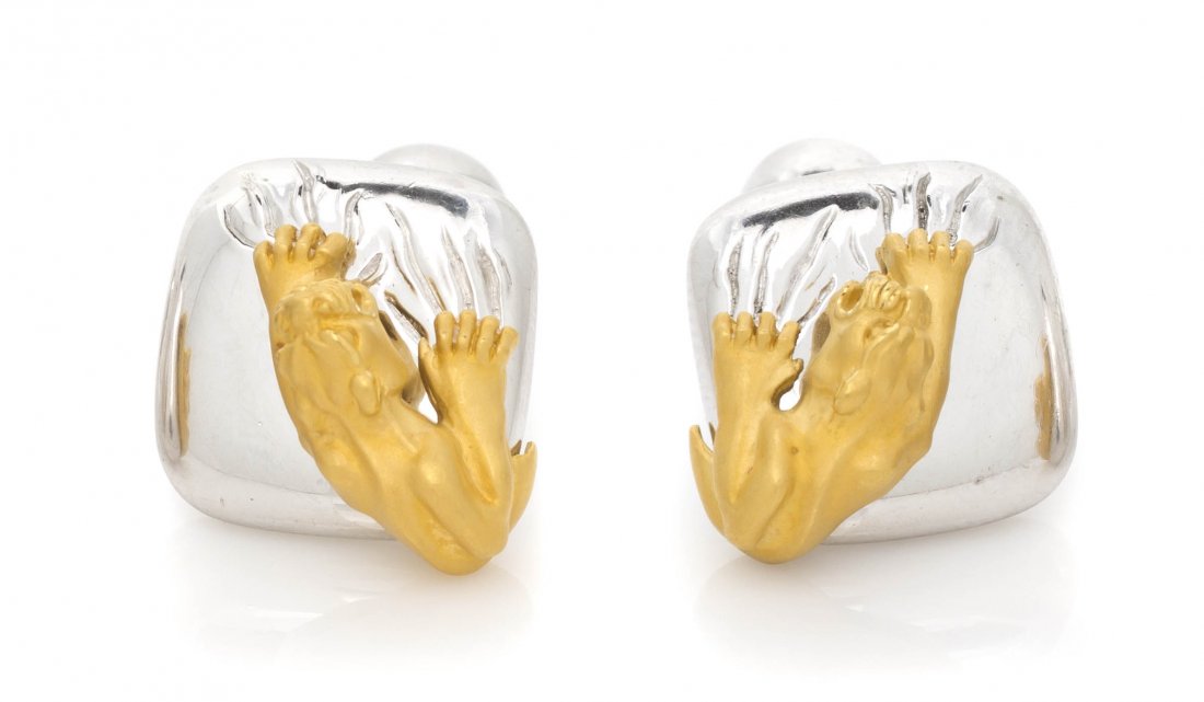 A Pair of Sterling Silver and Yellow Gold Cufflink: A Pair of Sterling Silver and Yellow Gold Cufflinks, depicting a matte finish gold panther raking its claws across a high polish silver surface. Stamp: 925 (maker's mark) 209514. 13.80 dwts. Property 