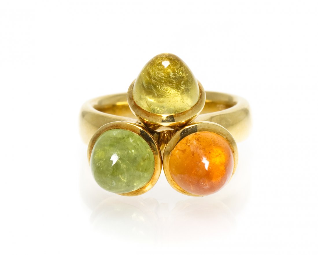 An 18 Karat Yellow Gold and Multi Gem Mikado Sixti: An 18 Karat Yellow Gold and Multi Gem Mikado Sixties Ring, Tamara Comolli, containing three bullet shape cabochon cut stones including yellow beryl, peridot and spessartite garnet, each measuring appr