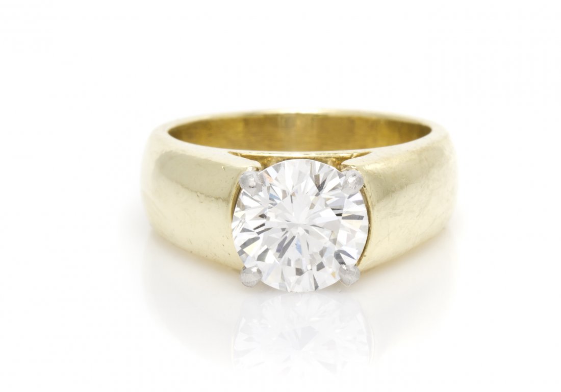 An 18 Karat Yellow Gold and Diamond Solitaire Ring: An 18 Karat Yellow Gold and Diamond Solitaire Ring, containing one round brilliant cut diamond weighing approximately 2.00 carats. Stamp: 18K. Accompanied by a Gemological Institute of America diamond