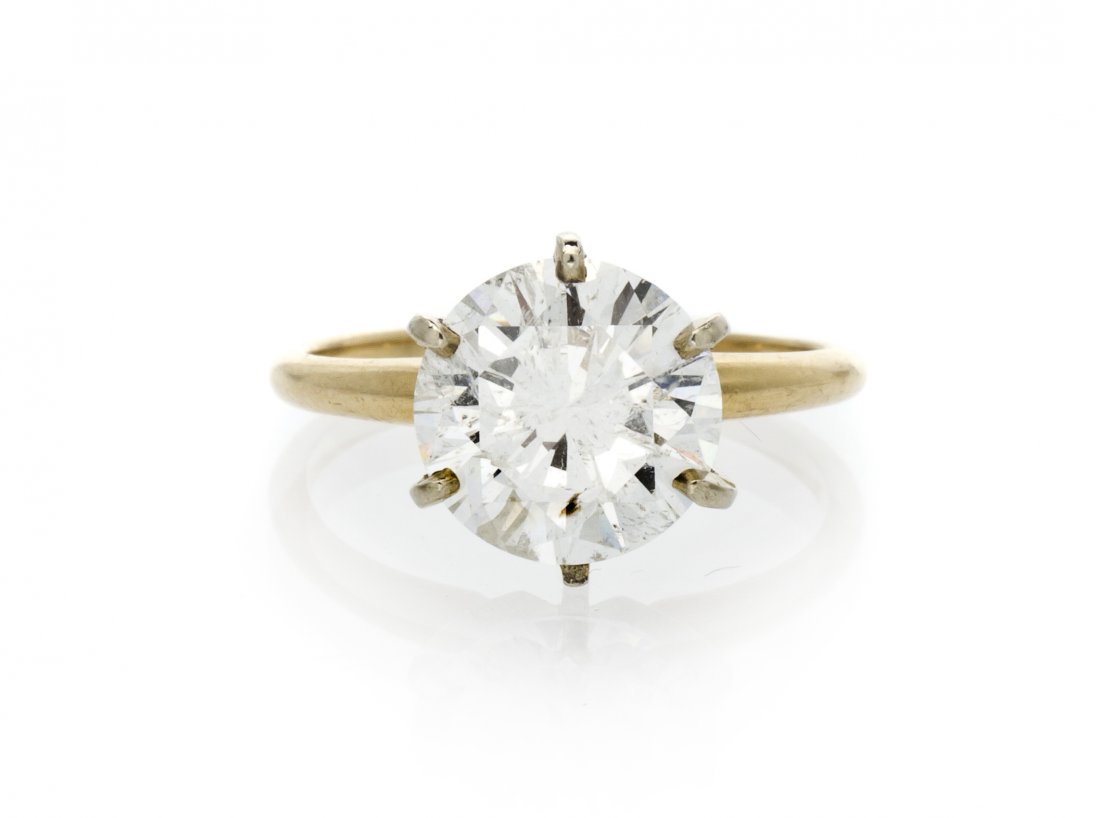 A 14 Karat Yellow Gold and Diamond Solitaire Ring,: A 14 Karat Yellow Gold and Diamond Solitaire Ring, containing one round brilliant cut diamond weighing approximately 3.60 carats. Accompanied by a Professional Gem Sciences Carte Blu report number 370