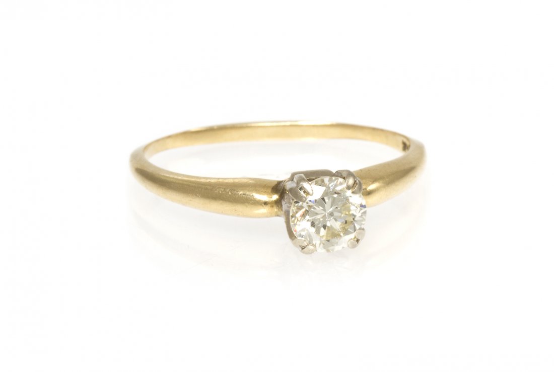 A 14 Karat Yellow Gold and Diamond Solitaire Ring,: A 14 Karat Yellow Gold and Diamond Solitaire Ring, containing one round brilliant cut diamond weighing approximately 0.55 carat. Stamp: 14K. 1.30 dwts.