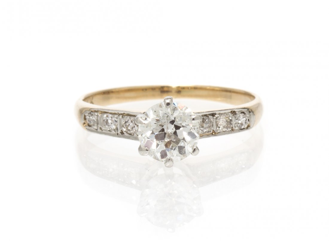 A 14 Karat Yellow Gold and Diamond Ring, 1.30 dwts: A 14 Karat Yellow Gold and Diamond Ring, containing one old European cut diamond weighing approximately 0.76 carat and six single cut diamonds weighing approximately 0.08 carat total. 1.30 dwts. Prope