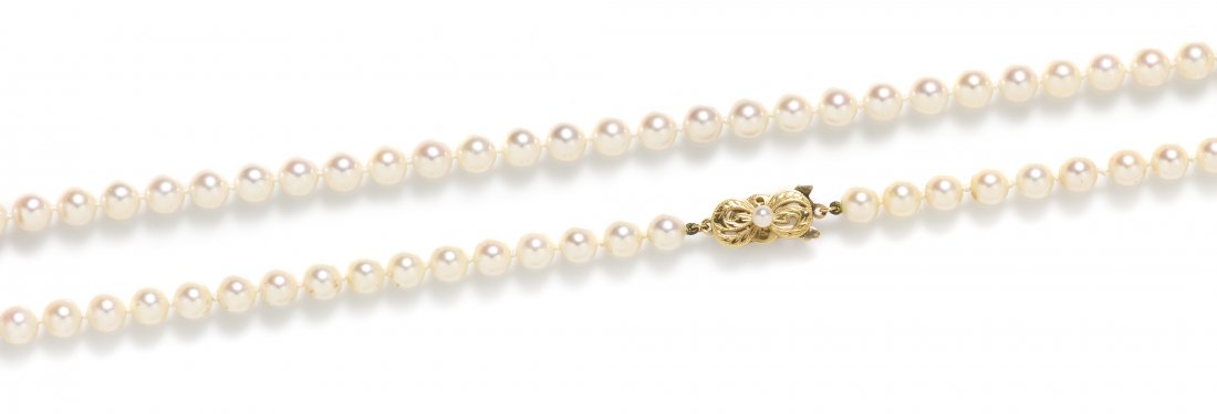 A Single Strand of Cultured Pearls, Mikimoto,: A Single Strand of Cultured Pearls, Mikimoto, containing numerous pearls measuring approximately 6.30 mm in diameter strung knotted with an 18 karat yellow gold openwork clasp with engraved foliate ac