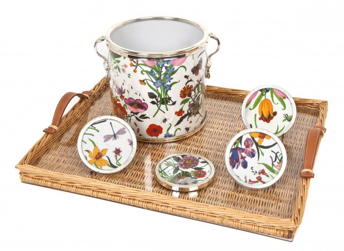 An Hermes Wicker Tray, Length of tray 20 3/4 x widt: An Hermes Wicker Tray, of rectangular form with leather handles, together with a Gucci ice bucket and four matching coasters. Length of tray 20 3/4 x width 17 1/4 inches. Property from the Collection