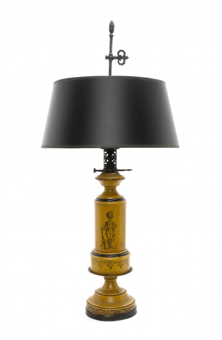 A Yellow Tole Table Lamp, Height 18 inches.: A Yellow Tole Table Lamp, of columnar form decorated with a solider, raised on a circular foot. Height 18 inches.