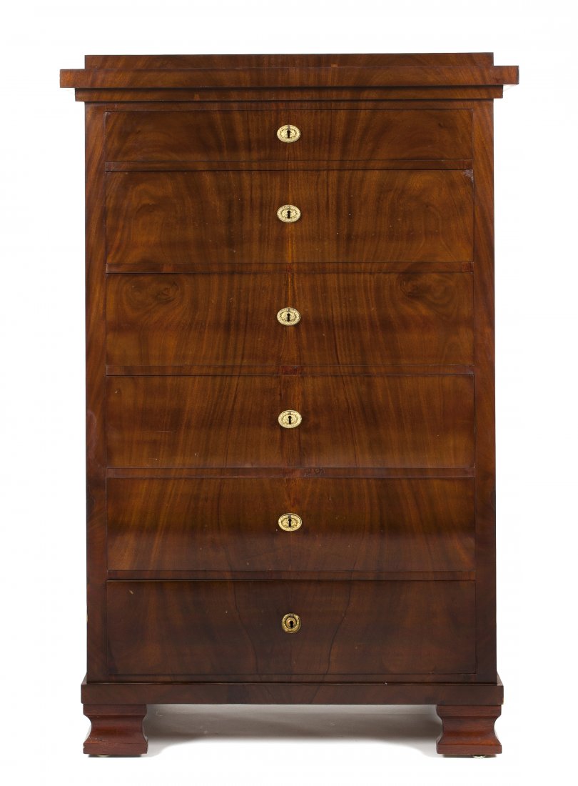 A Biedermeier Mahogany Chest of Drawers, Height 57 : A Biedermeier Mahogany Chest of Drawers, having a rectangular stepped top over a series of six drawers, raised on bracket feet. Height 57 x width 33 x depth 19 inches. Property from a Private Midwest 