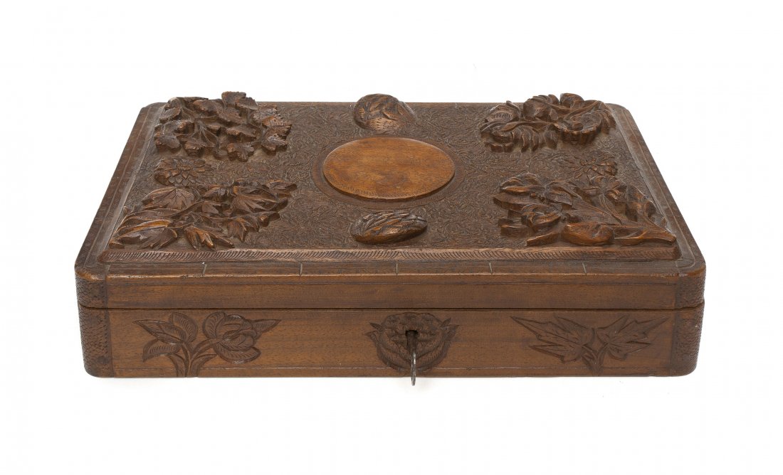 A Continental Carved Walnut Letter Box, Height 3 1/: A Continental Carved Walnut Letter Box, of rectangular form, having carved foliate decoration throughout. Height 3 1/2 inches.