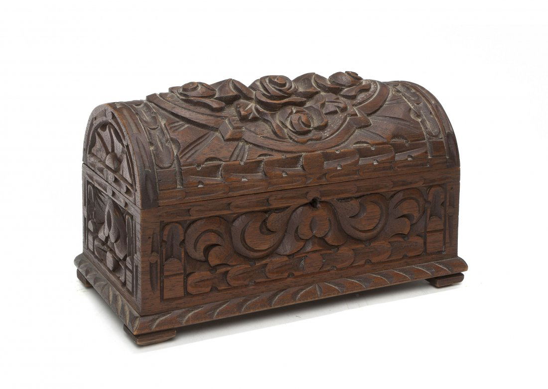 A Carved Walnut Table Casket, Height 6 inches.: A Carved Walnut Table Casket, of rectangular form having a domed lid with foliate carved decoration throughout. Height 6 inches.