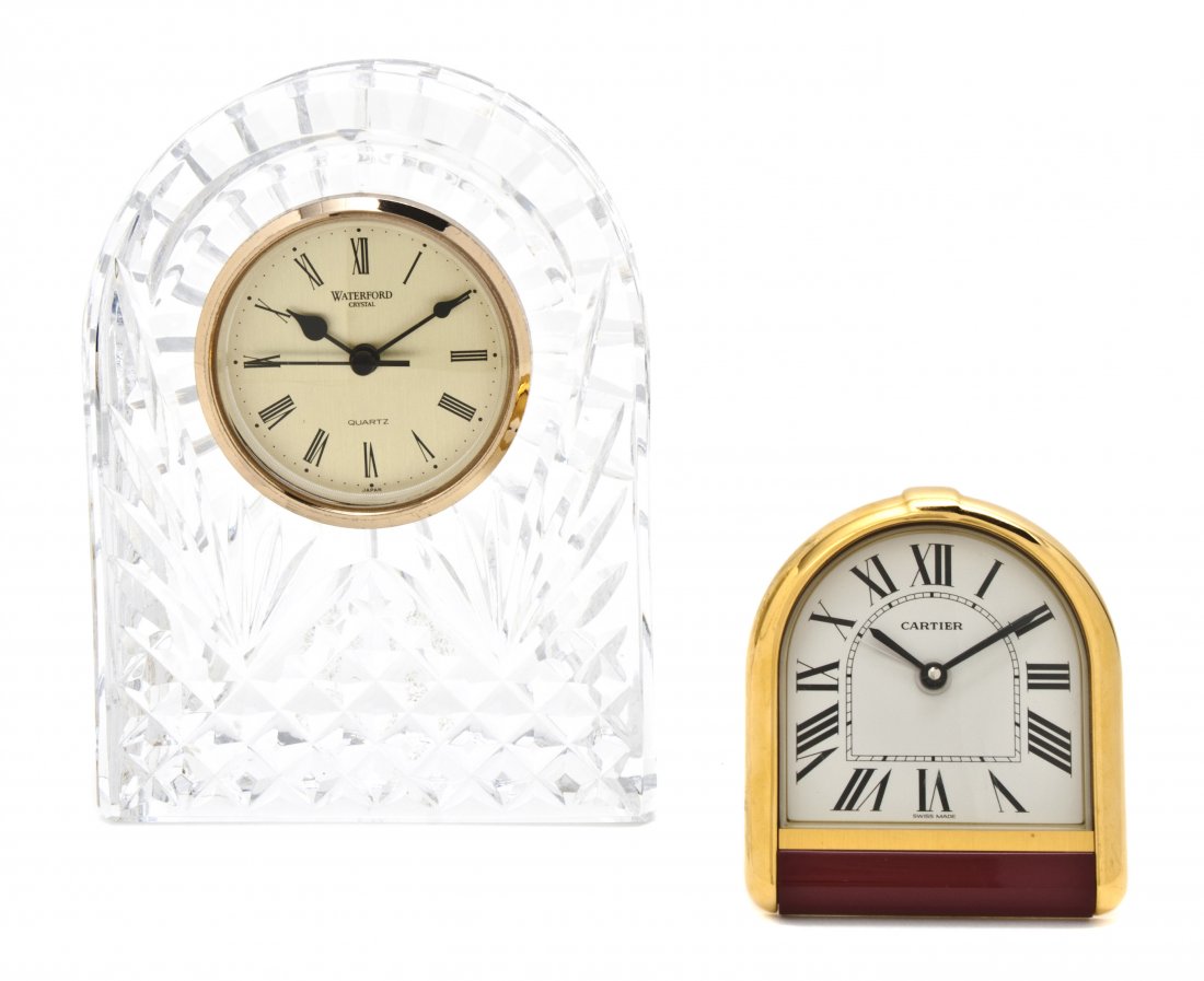 A Waterford Cut Glass Desk Clock, Height of talles: A Waterford Cut Glass Desk Clock, of arched form, together with a Cartier travel clock. Height of tallest 6 1/4 inches. Property from a Private Collector, Palm Beach, Florida