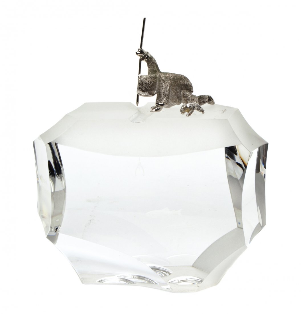 A Steuben Glass Figure, Arctic Fisherman, Height o: A Steuben Glass Figure, Arctic Fisherman, designed by James Houston, 1970, depicting a sterling silver figure of a fisherman spear fishing with two fish swimming below, having an engraved signature, s