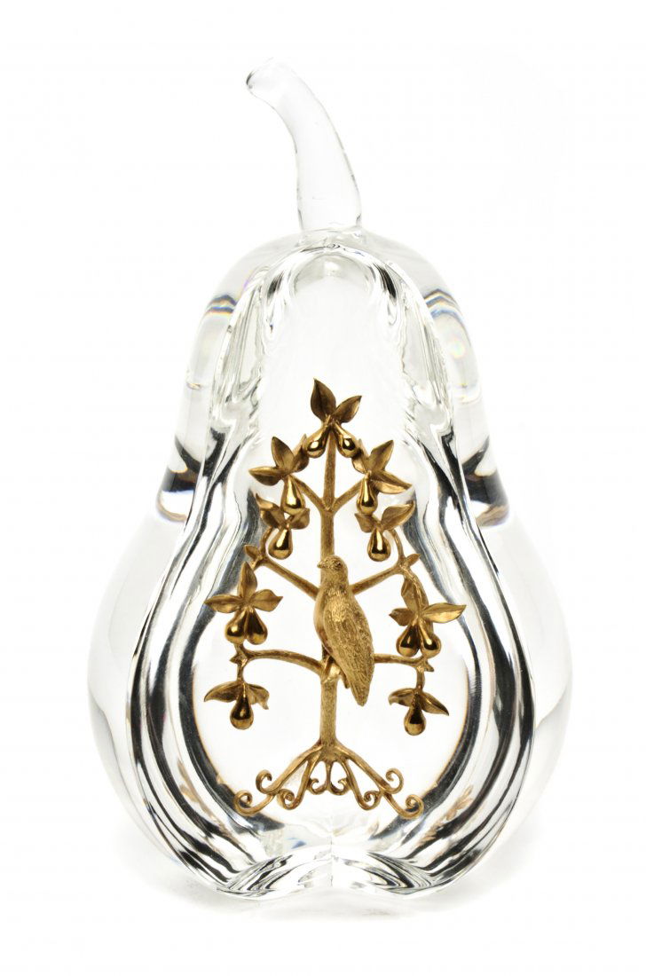 A Steuben Glass and 18 Karat Gold Partridge in a P: A Steuben Glass and 18 Karat Gold Partridge in a Pear Tree, in the form of a pear and inset with a gold partridge in a tree, etched Steuben on base. Height 6 1/4 inches. Property from the Estate of He