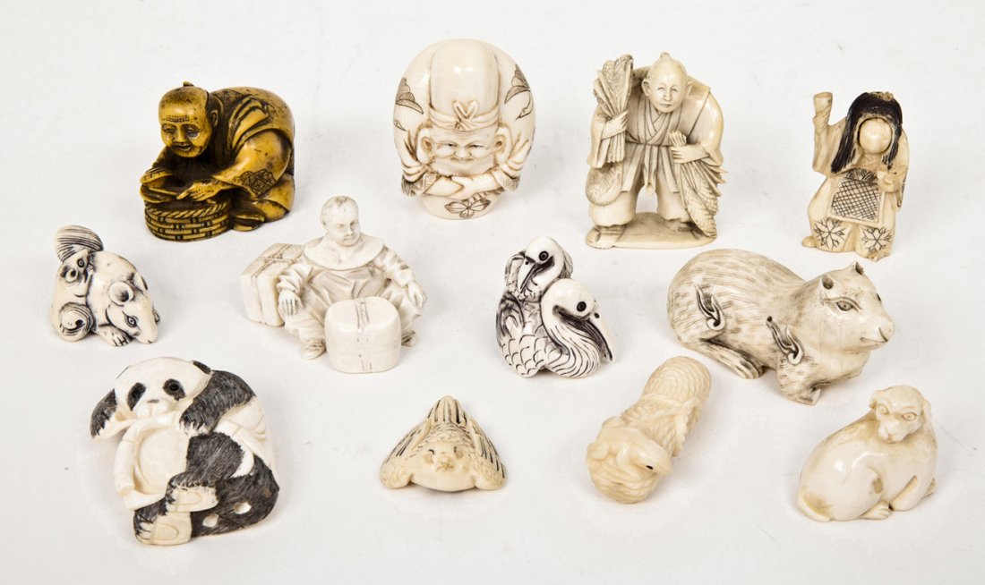 A Collection of Twelve Ivory Netsukes, Height of t: A Collection of Twelve Ivory Netsukes, comprising five figural forms and seven animal forms. Height of tallest 2 1/4 inches.