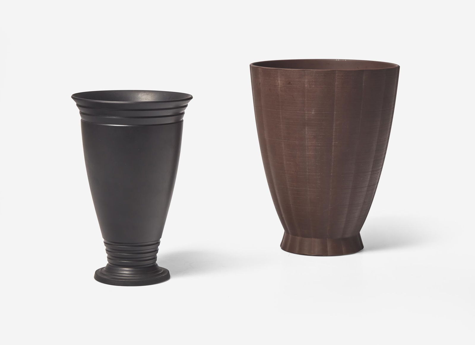 Two Wedgwood Keith Murray Designed Black Basalt Vases, UK, 1930s: Two Wedgwood Keith Murray Designed Black Basalt Vases, UK, 1930s Stoneware One in bronzed basalt, the other in plain black Both impressed “WEDGWOOD” “MADE IN ENGLAND”, printed
