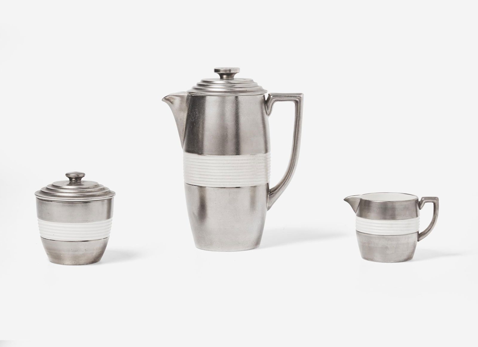 A Wedgwood Keith Murray Designed Coffee Service, UK, 1930s: A Wedgwood Keith Murray Designed Coffee Service, UK, 1930s Glazed and lustre decorated earthenware Designed by Keith Murray (1892-1981); Queensware with the Moonstone glaze, platinum lustre decoration