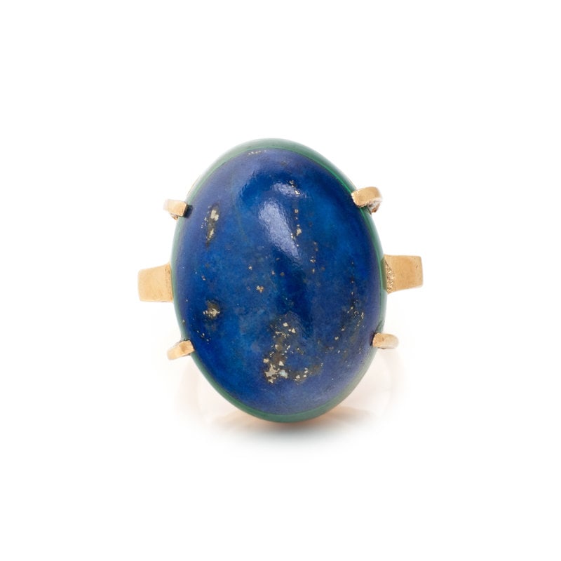 YELLOW GOLD, LAPIS LAZULI AND MALACHITE RING: YELLOW GOLD, LAPIS LAZULI AND MALACHITE RING Affixed lapis lazuli and malachite cabochon measuring approximately 23.00 x 17.50 mm. Ring size 6. Stamp: (obscured). Gross weight: 9.95 dwt. <