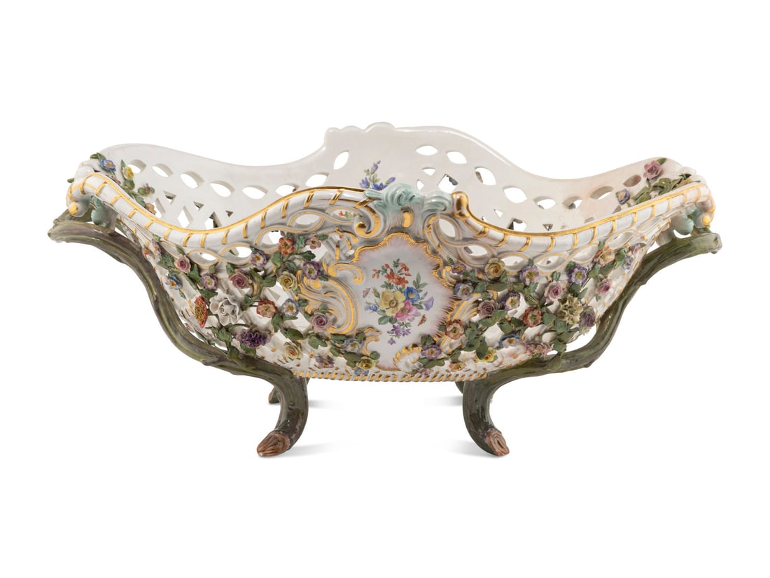 A Large Meissen Porcelain Reticulated Centerpiece Basket: A Large Meissen Porcelain Reticulated Centerpiece Basket 19th Century bearing crossed swords in underglaze blue and incised E. 141 to the underside. Height 11/2 x width over handles 28 1/2 x depth 20 