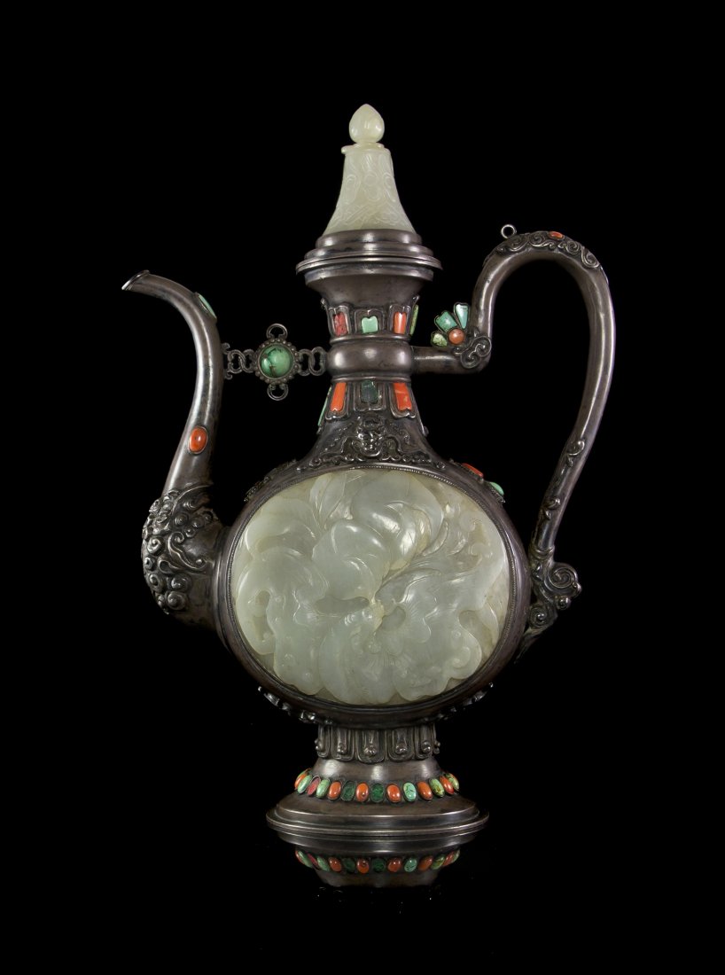 A Chinese White Jade Embellished Silver Ewer, Heigh: A Chinese White Jade Embellished Silver Ewer, the main body of flattened globular form containing two carved white jade panels below raised silver bats, carved in relief with a bat holding a branch of