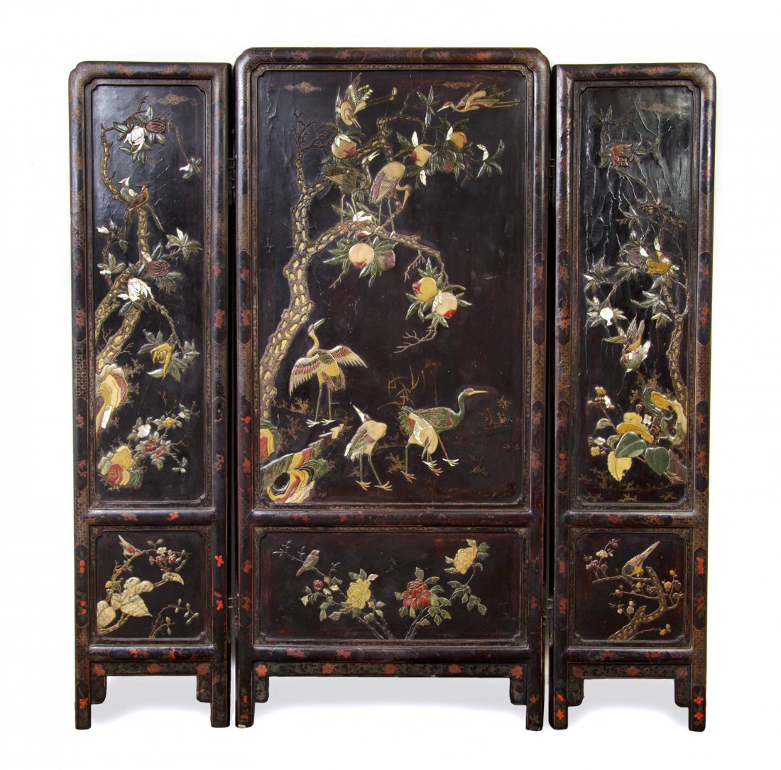 A Chinese Three-Panel Stone, Shell Inset, Hardwood: A Chinese Three-Panel Stone, Shell Inset, Hardwood and Gilt Floor Screen, Qing Dynasty, depicting a scene of cranes amongst a fruiting peach tree with ripe fruit throughout with cranes perched in the 