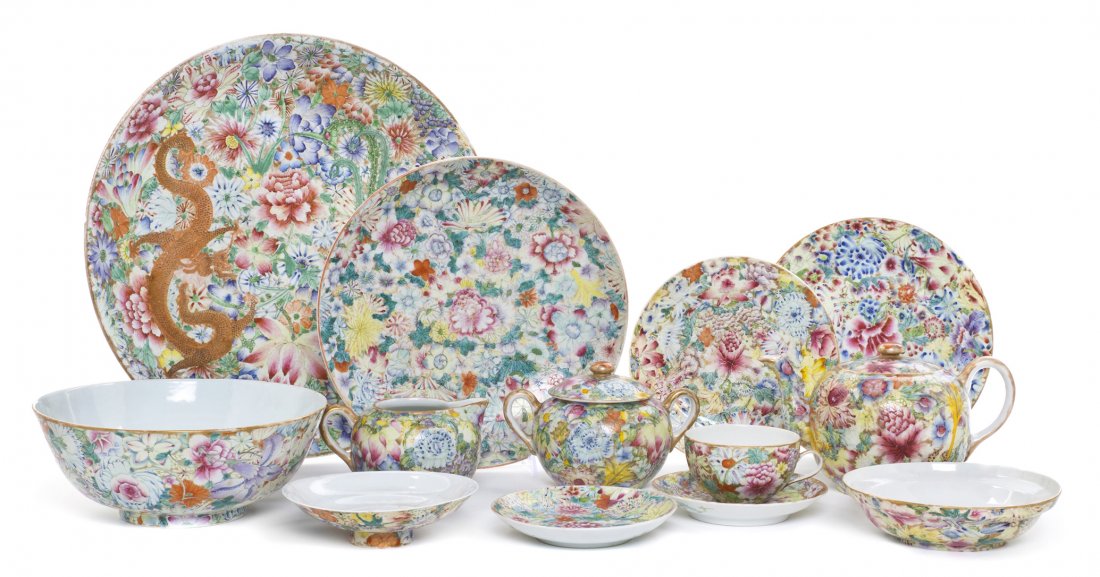A Famille Rose 'Millefleur' Porcelain Partial Dinn: A Famille Rose 'Millefleur' Porcelain Partial Dinner Service, comprising 10 teacups, 11 saucers, a teapot, a lidded double handled sugar, a creamer, a waste bowl, 12 salad plates, 4 dinner plates, a c