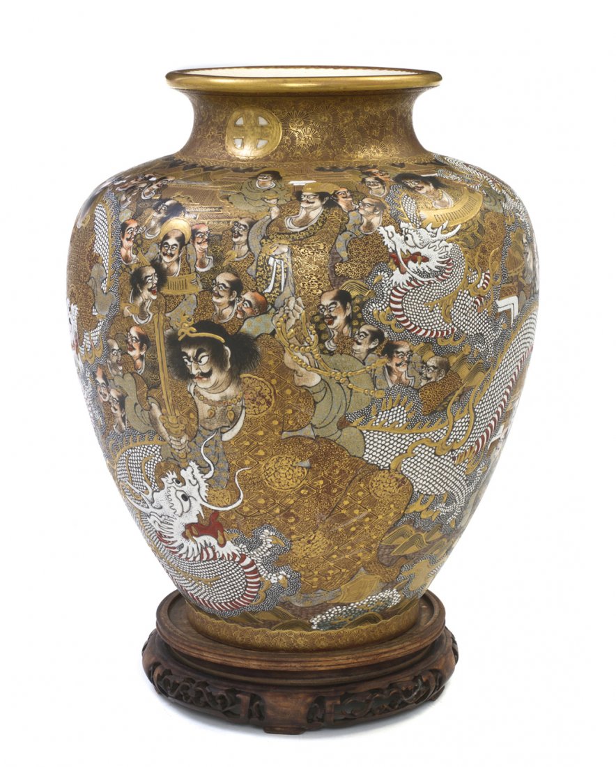A Japanese Satsuma Vase, Height 12 inches.: A Japanese Satsuma Vase, of baluster form having gilt and polychrome decoration of arhats amongst sinuous white dragons, bearing the Shimazu family crest and Dai Nippon Satsuma Fuzan-zo marks to the u