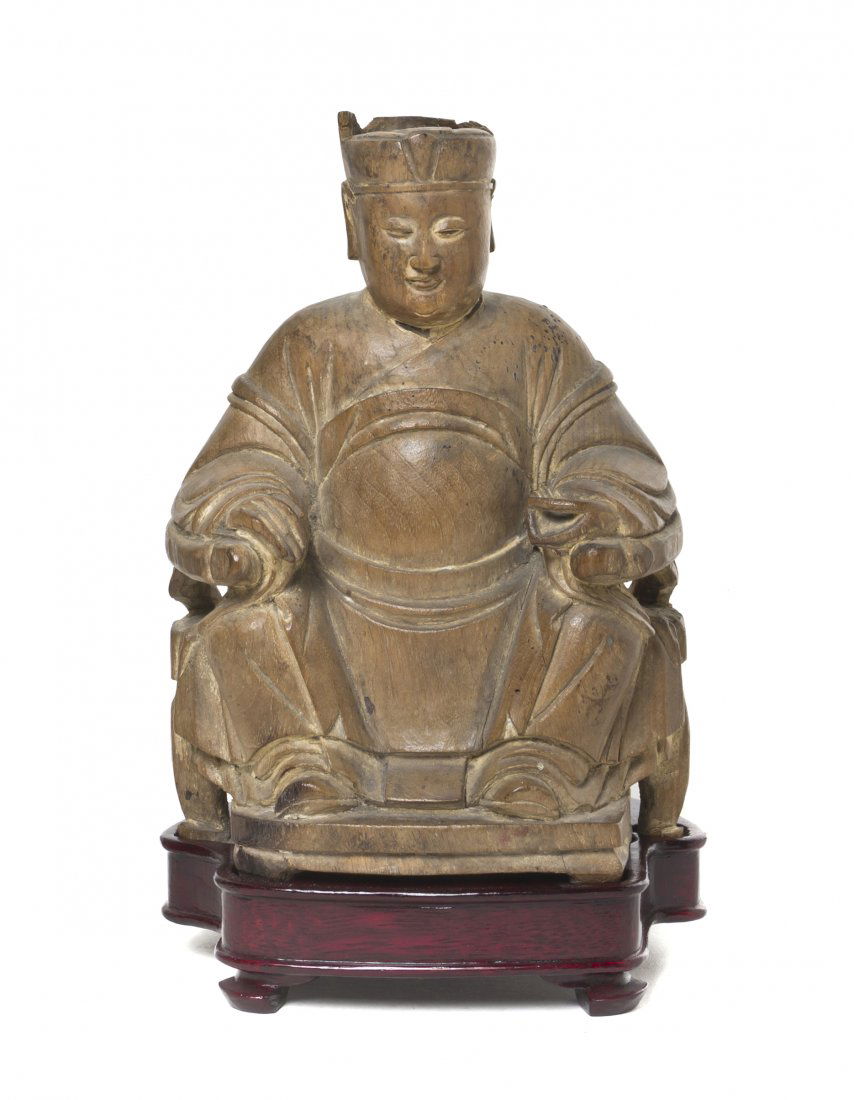 A Chinese Carved Wood Model of a Seated Gentleman,: A Chinese Carved Wood Model of a Seated Gentleman, late Ming/early Qing Dynasty, shown wearing traditional robes, seated in a horseshoe-back armchair, with some remnants of polychrome decoration, rais