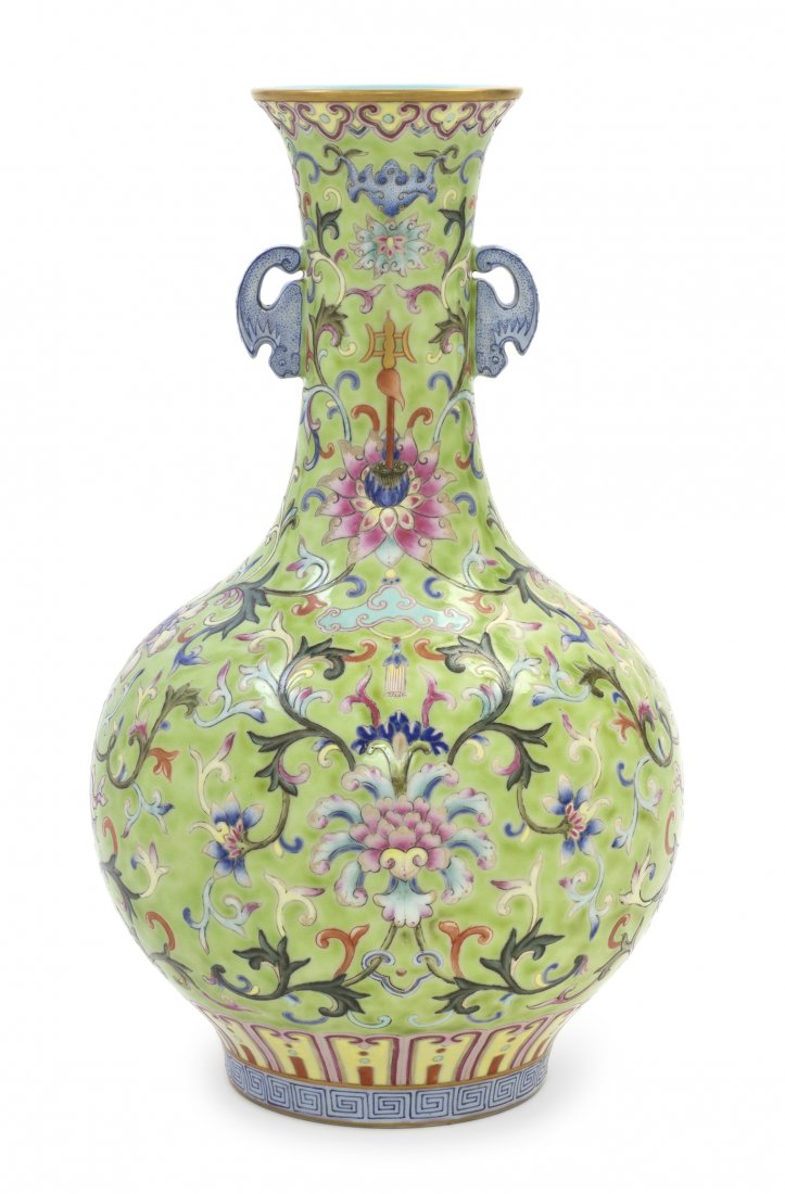 A Chinese Famille Rose Porcelain Vase, Height 12 5: A Chinese Famille Rose Porcelain Vase, of baluster form, having scrolling foliate decoration throughout with blue bat form handles with other bats interspersed in the main body, raised above a repetit