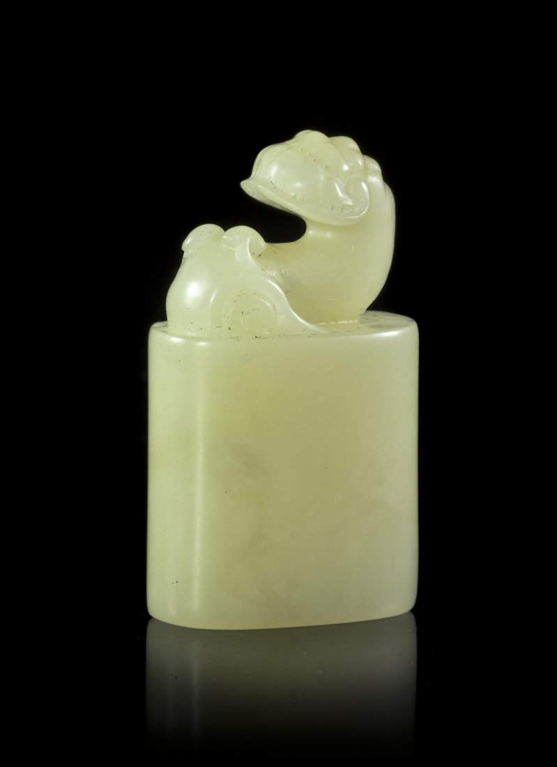 A Carved Soapstone Seal, Height of seal 1 5/8 inch: A Carved Soapstone Seal, of pale celadon colored stone with a lingzhi form finial with carved seal on the underside, contained in a rosewood box. Height of seal 1 5/8 inches; length of box 4 3/8 inche