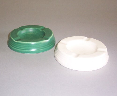 PAIR OF KEITH MURRAY FOR WEDGWOOD ASHTRAY: PAIR OF KEITH MURRAY FOR WEDGWOOD ASHTRAYS Glazed ceramic; one matte green, one moonstone, each with ink & stamped marks, dia: 4 1/4 in.