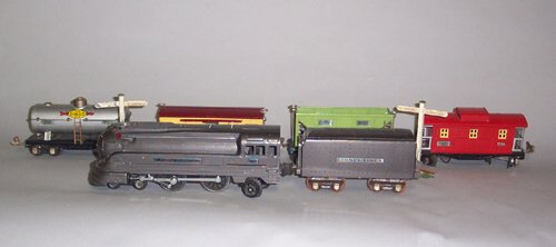LIONEL "O" GAUGE TOY TRAIN SET Mixed me: LIONEL "O" GAUGE TOY TRAIN SET Mixed metals; includes PRR engine #238E in box, coal car #653 in box, box car #655 in box, oil tank car #654 in box, tender with whistle #265W in box and caboose #657 in